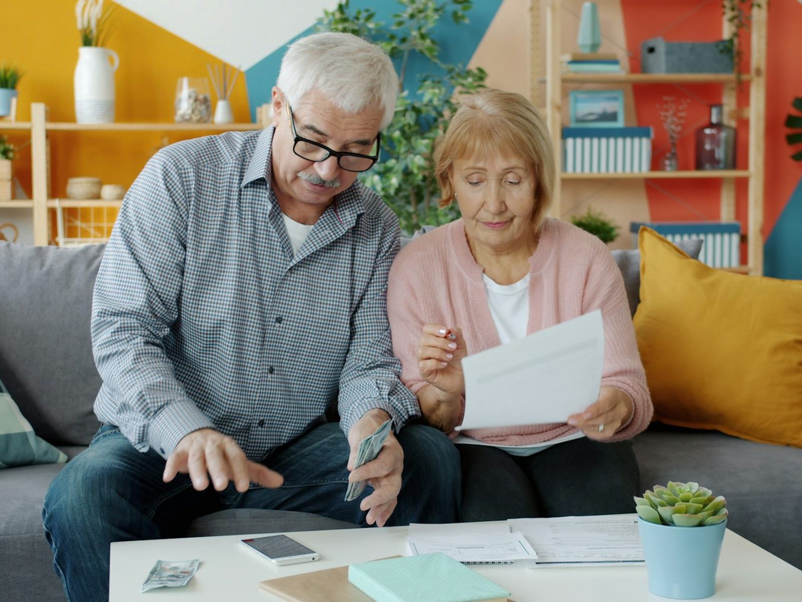 A couple reviewing documents together at home